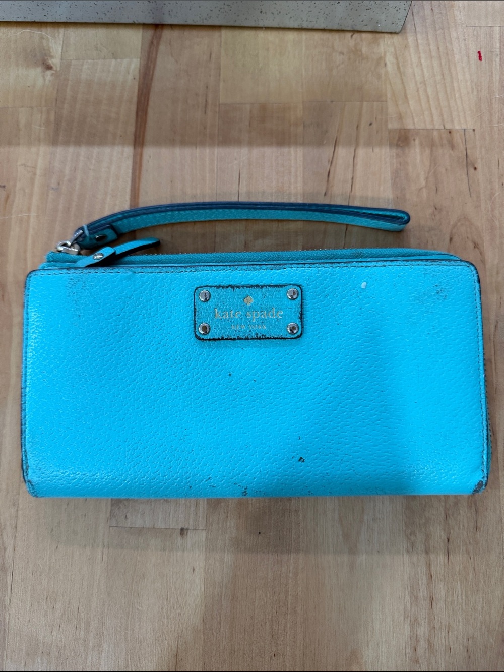 Kate Spade New York  Pebbled Leather Zip Around Wallet flawed